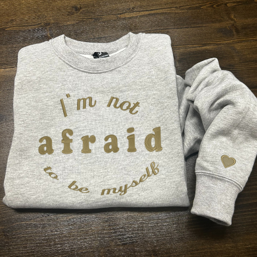 Džemperis su siuvinėtu užrašu " I'm not afraid to be myself"