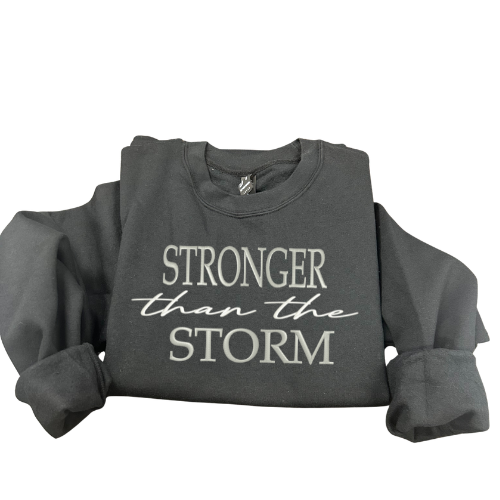 Siuvinėtas džemperis "Stronger then the storm"